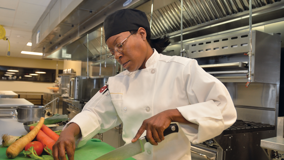 Culinary Arts photo of person working in kitchen