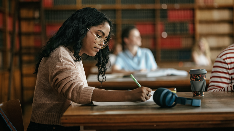 Paralegal studying in library