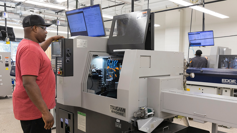 man at cnc machine