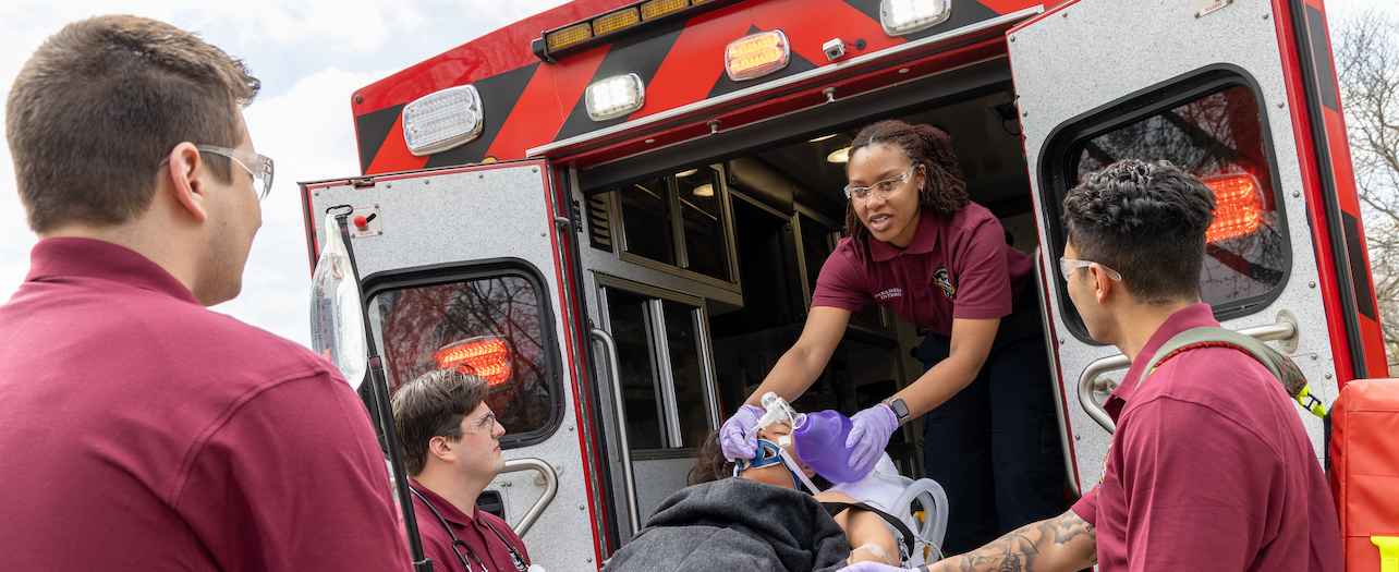 EMTs loading patient into ambulance
