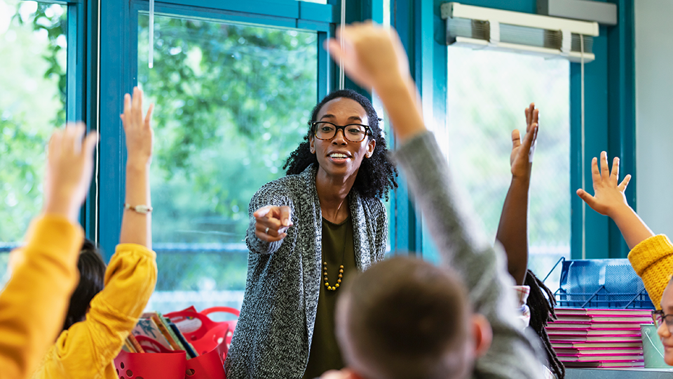 teacher and student in a classroom