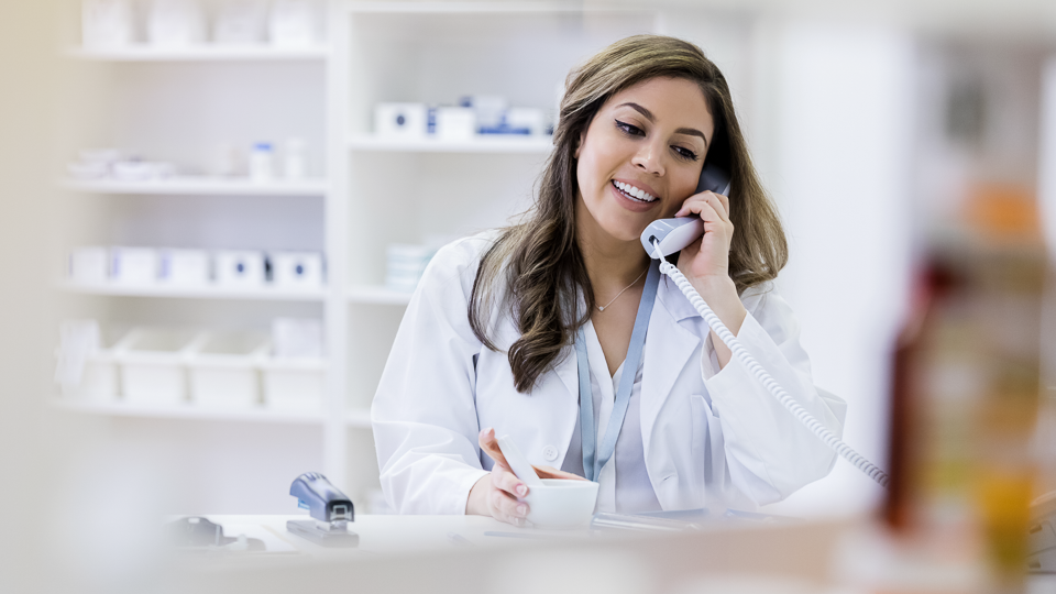 Health Unit Coordinator on phone