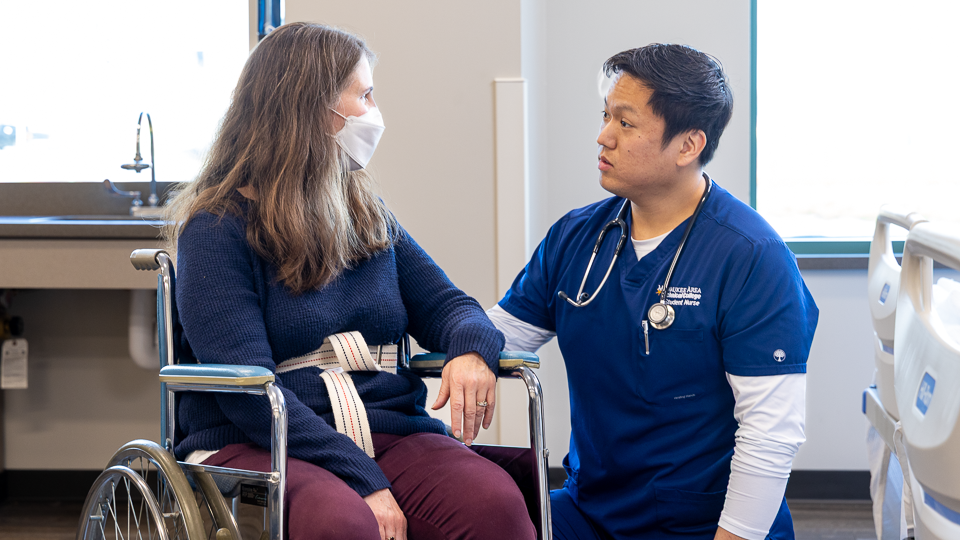 patient being assisted by an assistant