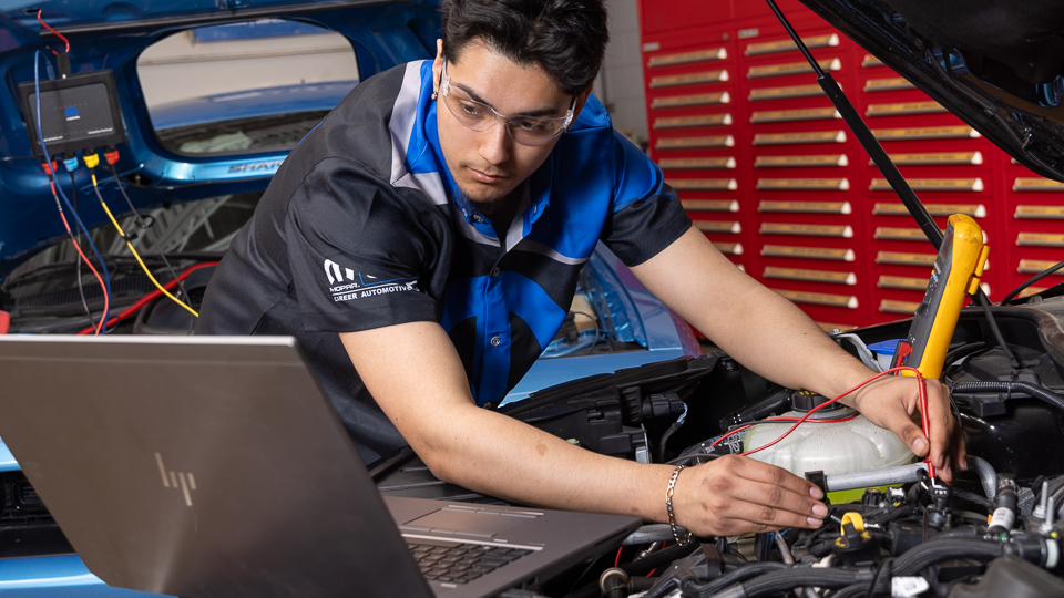 man working on car