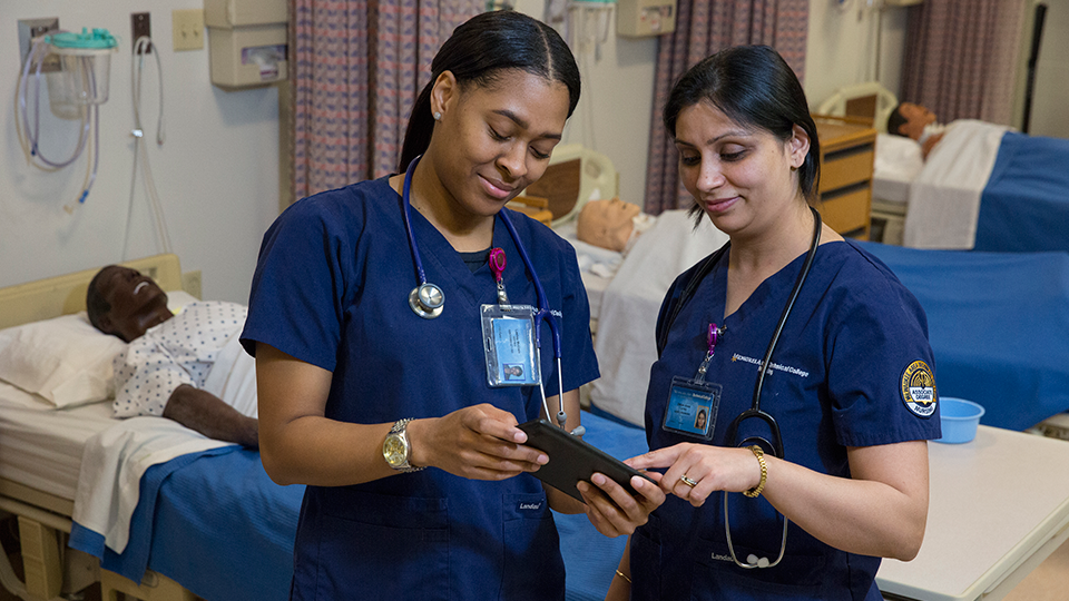 two nursing students in nursing lab