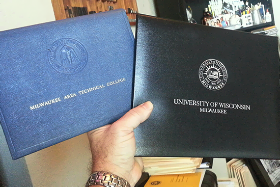 Gordie Gohr displays his college diplomas, earned 33 years apart.