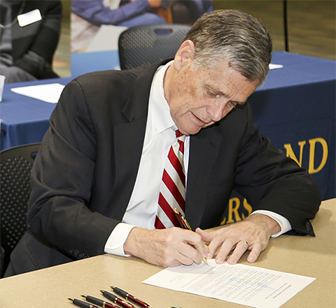 lakeland president signing agreement