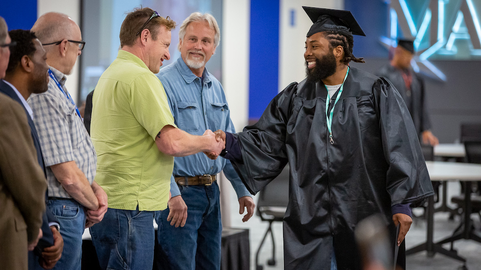 2nd chance Pell Grant student receives diploma from instructors