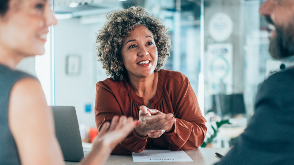 three co-workers in conversation