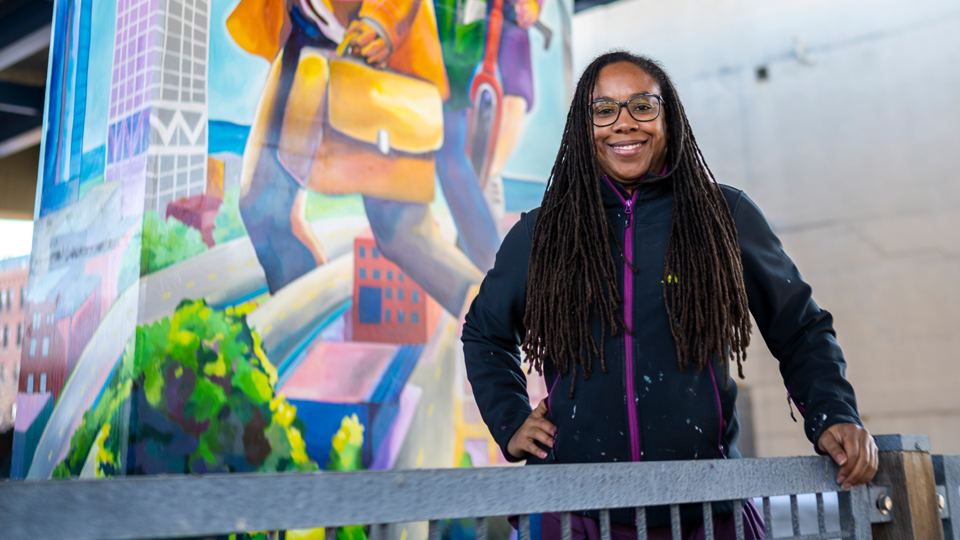 Tia Richardson in front of mural photo