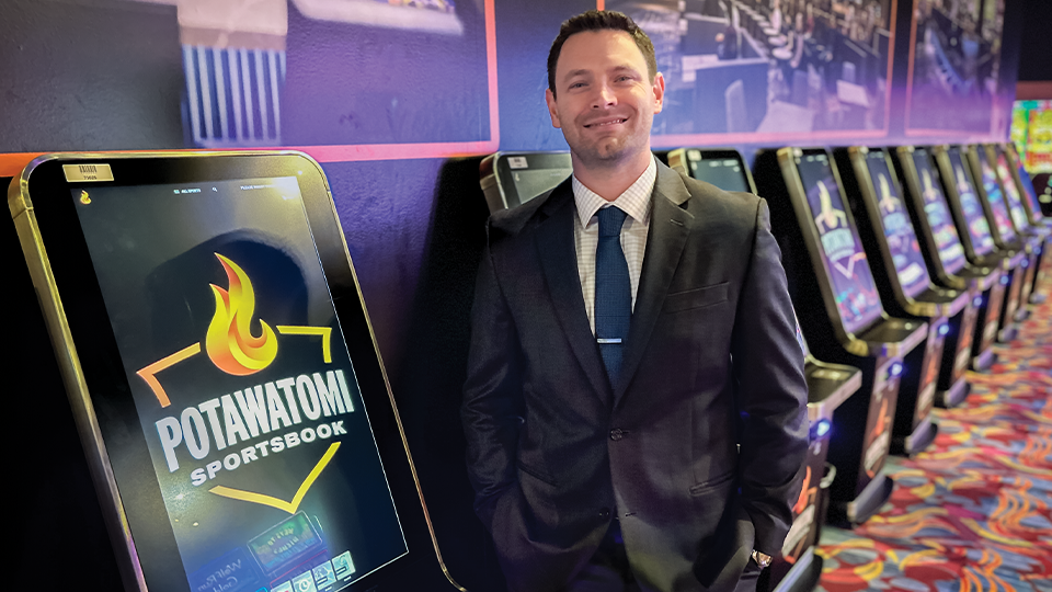 Adam Gruszcynski in front of sportsroom machines