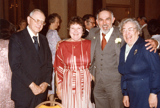 Phil Blank with people at a social gathering pic