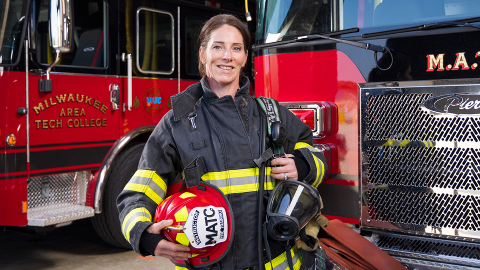 Alyssa in front of a fire truck