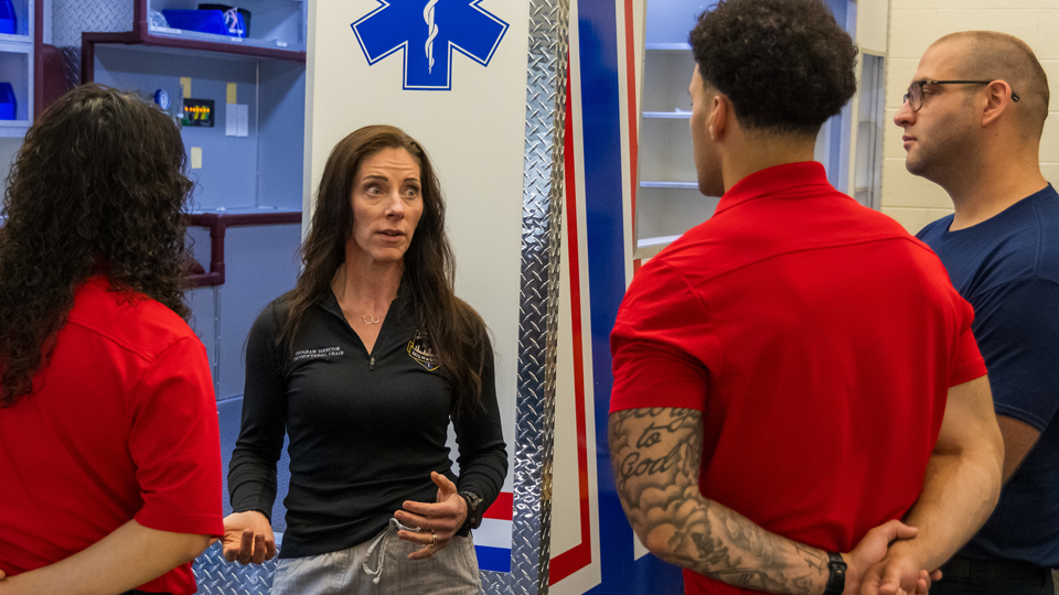 Alyssa teaching other students on how to help