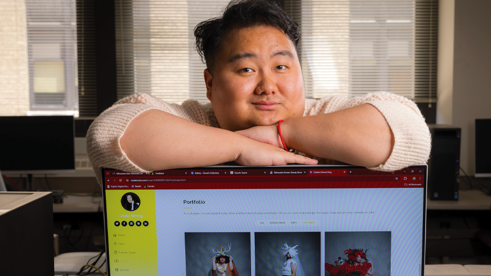 Yeng sitting on top of his website