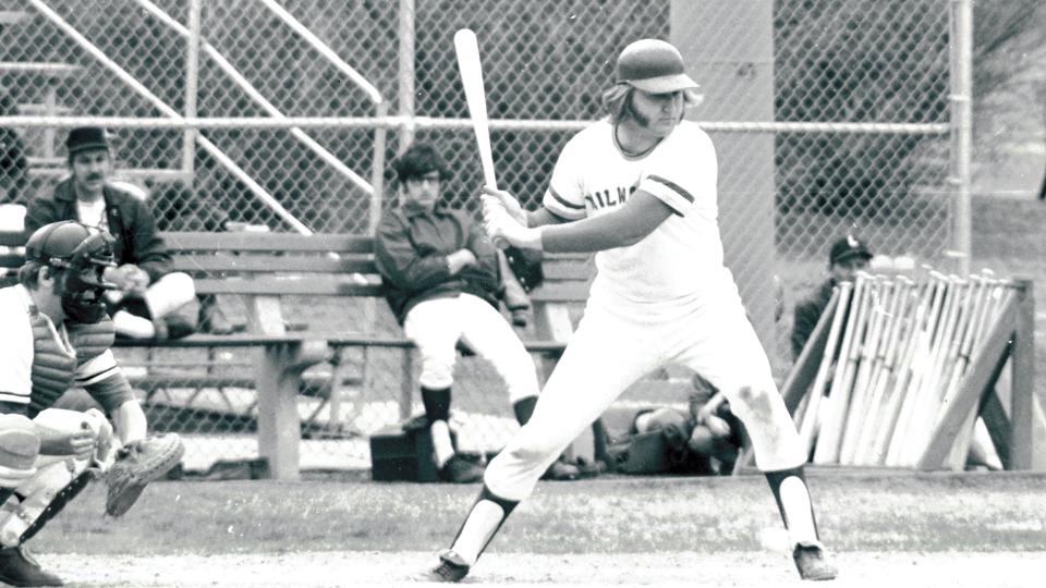Man swinging his baseball bat