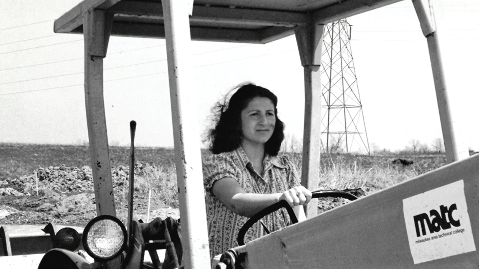 Woman driving a tractor